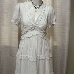 White brand new dress with cute waist details and trimmings